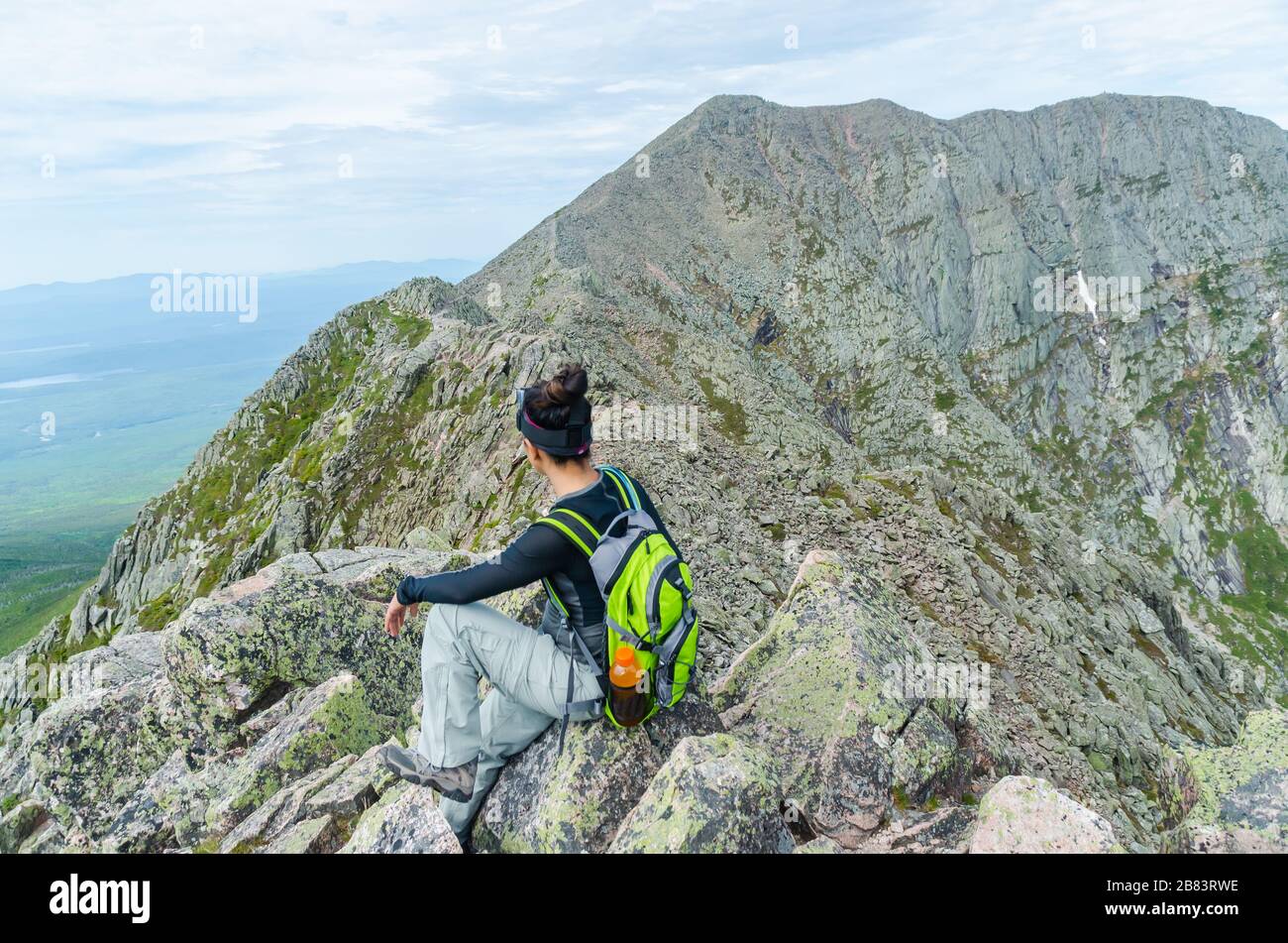 Woman hiking along Knife Edge Trail of Mount Katahdin Northeast