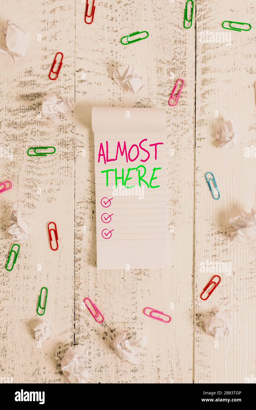 Conceptual Hand Writing Showing Almost There Concept Meaning Soon To Be Or Very Nearly Finished With Some Goal Or Task Stripped Ruled Notepad Clips P Stock Photo Alamy