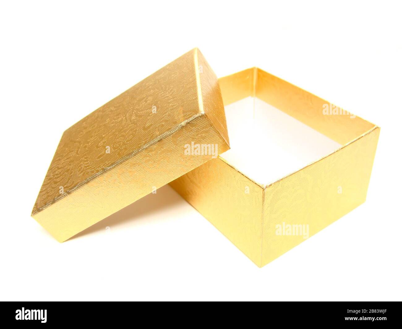 Opened empty gold gift box on a white background Stock Photo