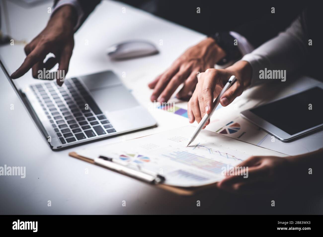 Group of business people hands working on wood desk in office top view ...
