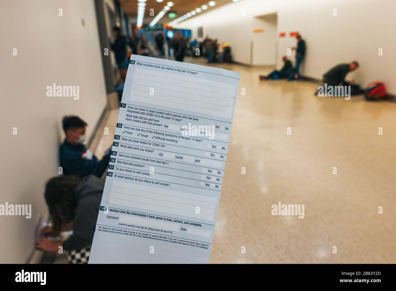 Newly revised COVID19-specific arrival cards given to arriving passengers at Auckland International Airport, New Zealand during the pandemic Stock Photo