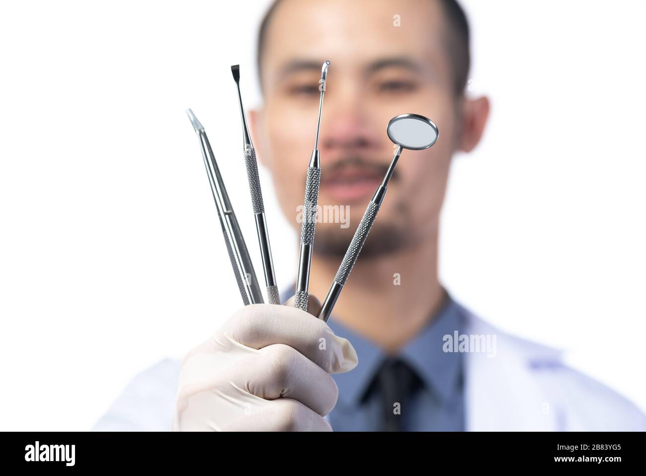 Dentist portraits and dental equipment, on white background Stock Photo