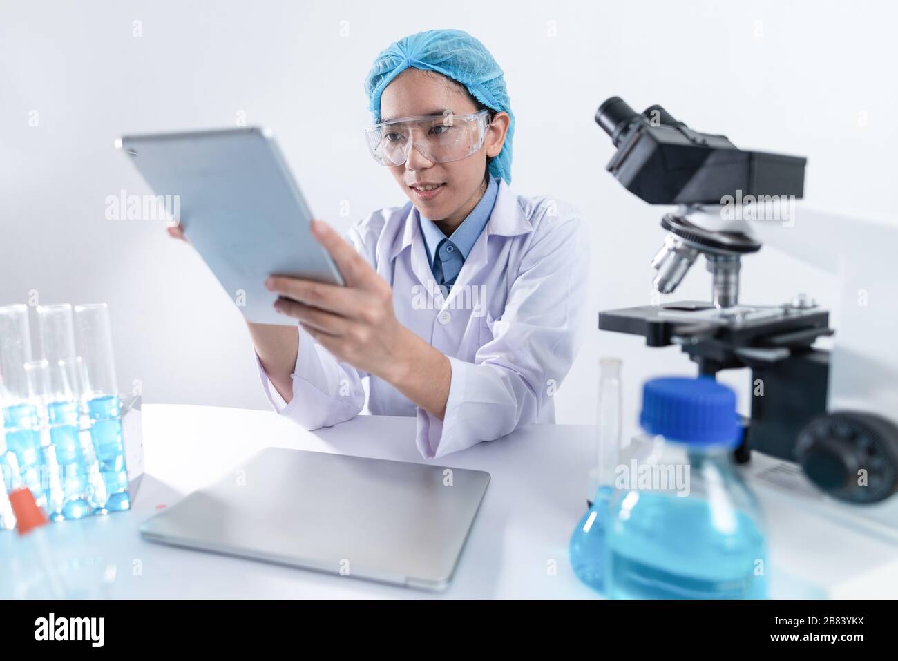 Scientists are working with digital tablet in laboratory Stock Photo