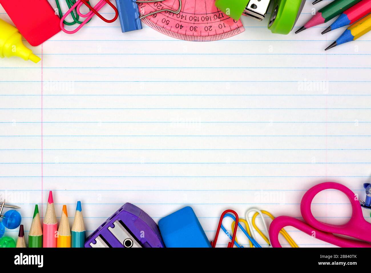 Colorful school supplies double border over a lined paper background Stock Photo