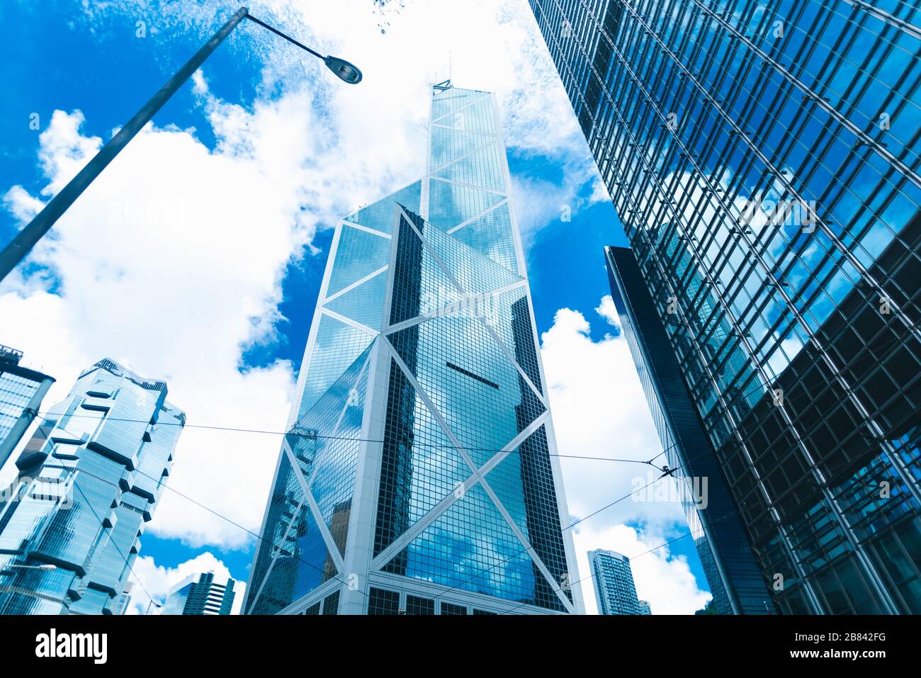 skyscraper building in Hong Kong, city view in blue filter Stock Photo ...