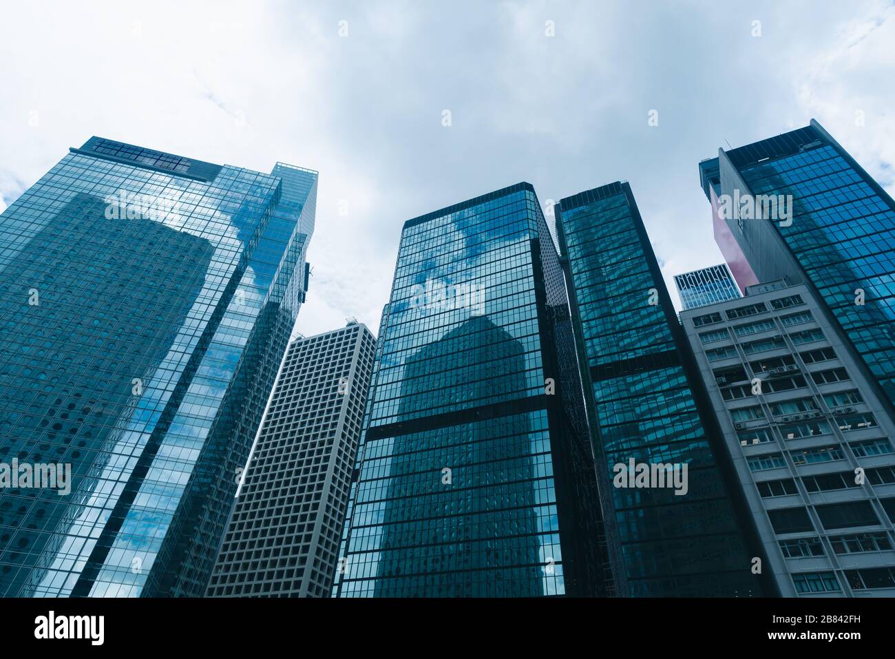skyscraper building in Hong Kong, city view in blue filter Stock Photo ...