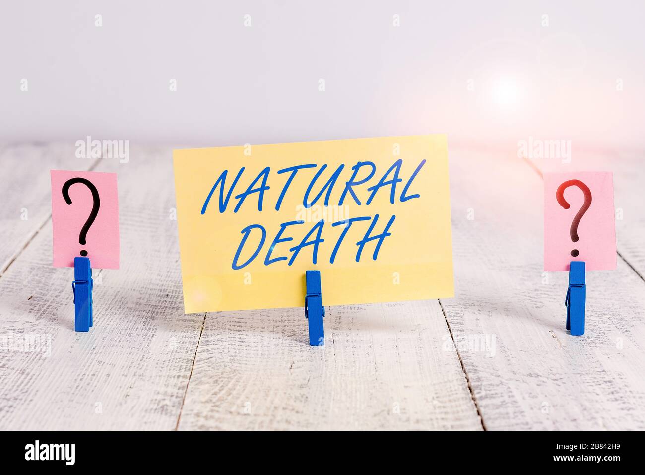 Conceptual hand writing showing Natural Death. Concept meaning occurring in  the course of nature and from natural causes Crumbling sheet with paper cl  Stock Photo - Alamy