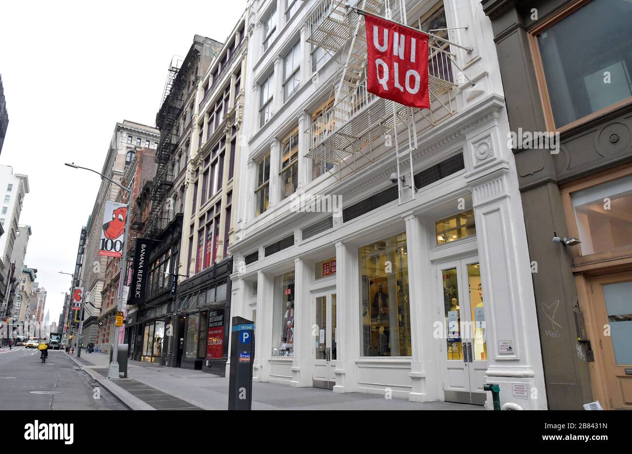 New York, USA. 19th Mar, 2020. A closed Manhattan Soho UNIQLO store is seen  in this photo devoid of any pedestrians, Thursday, March 19, 2020 in New  York. Fast Retailing Co. said