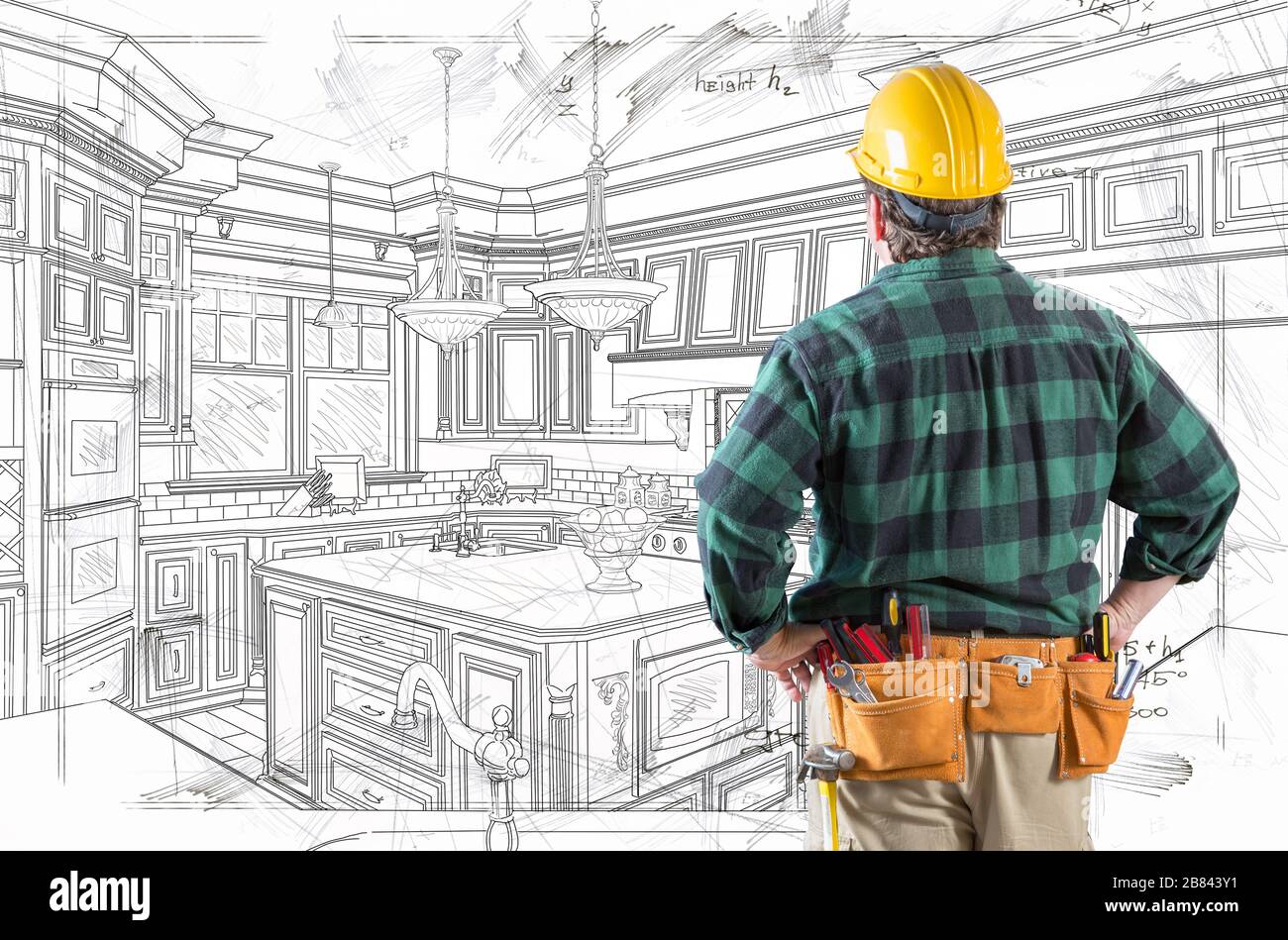 Contractor With Hard Hat and Tool Belt Facing Custom Kitchen Design Drawing Details . Stock Photo