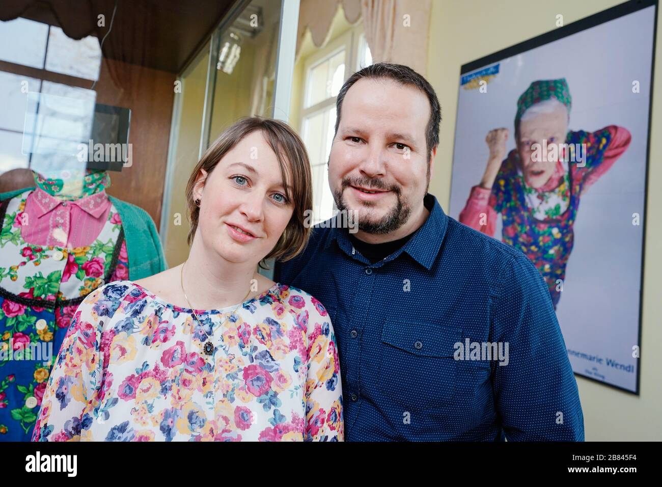Speyer, Germany. 03rd Mar, 2020. Jens and Stefanie Baldus, fans of the ARD television series 'Lindenstraße', stand in front of a picture of the series figure Else Kling in the permanent exhibition 'Lindenstraße' in the Museum Wilhelmsbau of the Technik Museum Speyer. (to dpa - Where the 'Lindenstraße' lives on - Else Klings kitchen as a museum piece) Credit: Uwe Anspach/dpa/Alamy Live News Stock Photo