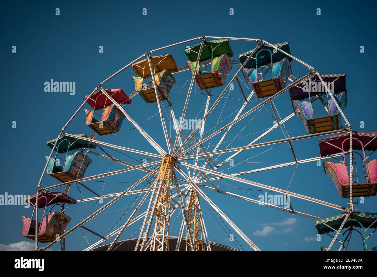 ferris wheel in street fair with background blue sky at sunset in Hidalgo state Stock Photo