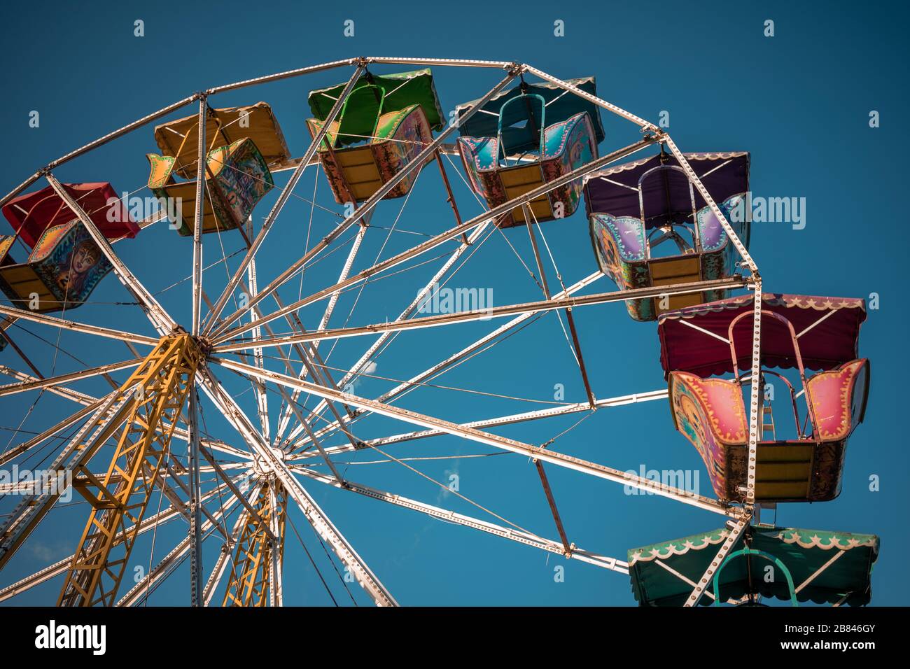 ferris wheel at the street fair with blue sky background at sunset in the state of Hidalgo Stock Photo