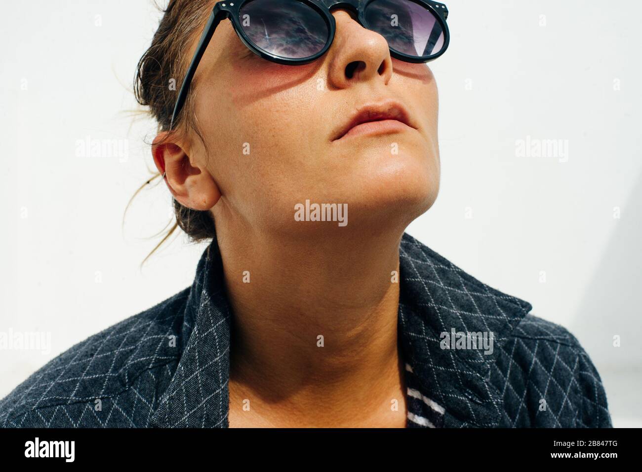 portrait girl in sunglasses on a white background Stock Photo - Alamy