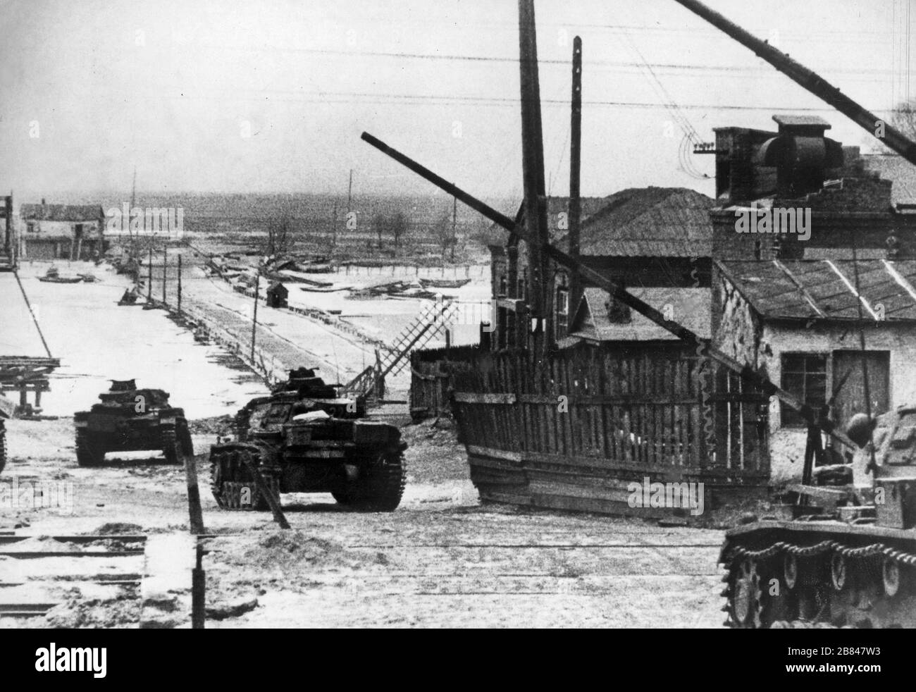 The German army entered Rostov. A column of PzKpfw III tanks goes through a railroad crossing. November 1941 Stock Photo