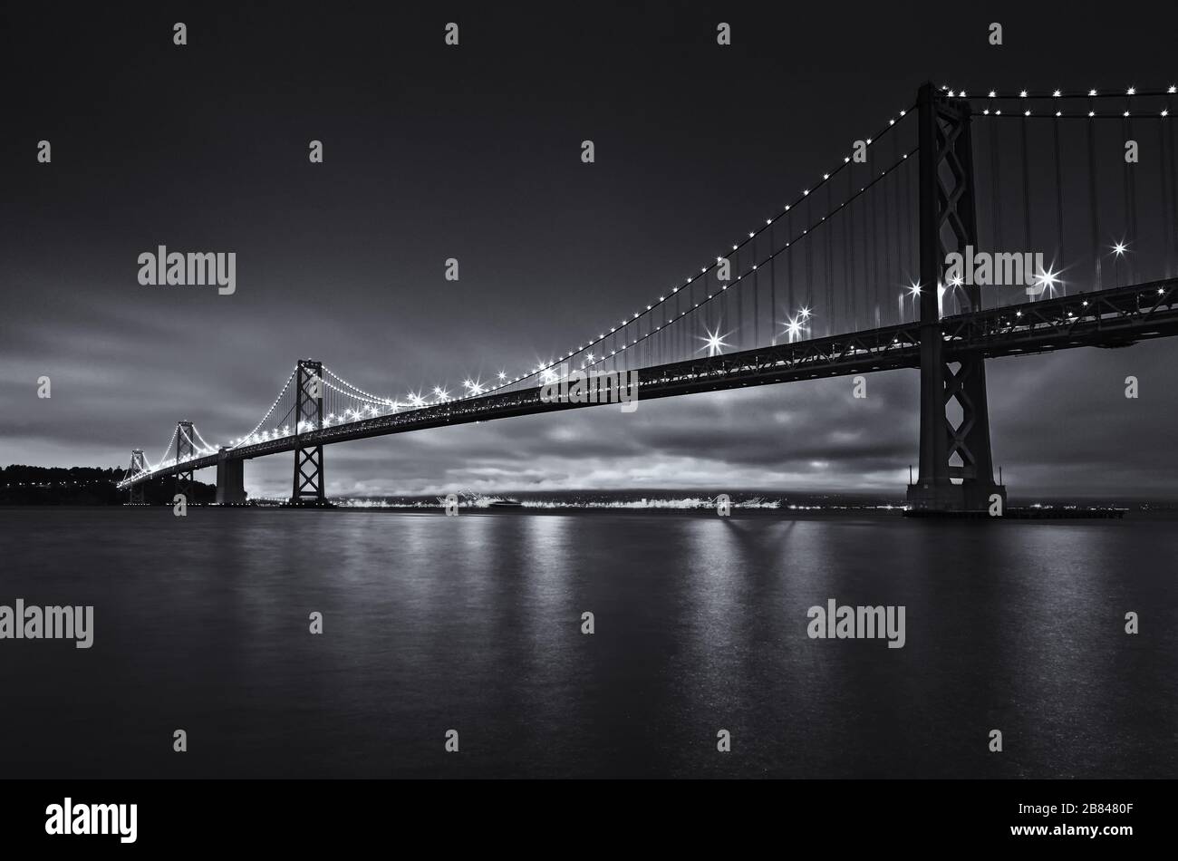 San Francisco Oakland Alameda County Bay Bridge at dusk, San Francisco, California, United States, North America, black and white Stock Photo
