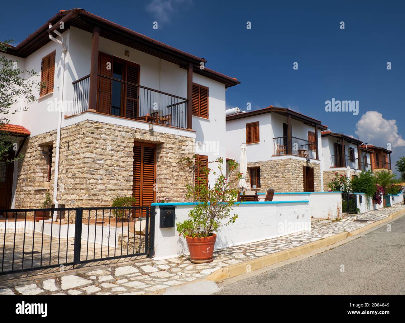 The street of modern white villas and houses of Pano Lefkara village. Larnaca District. Cyprus
