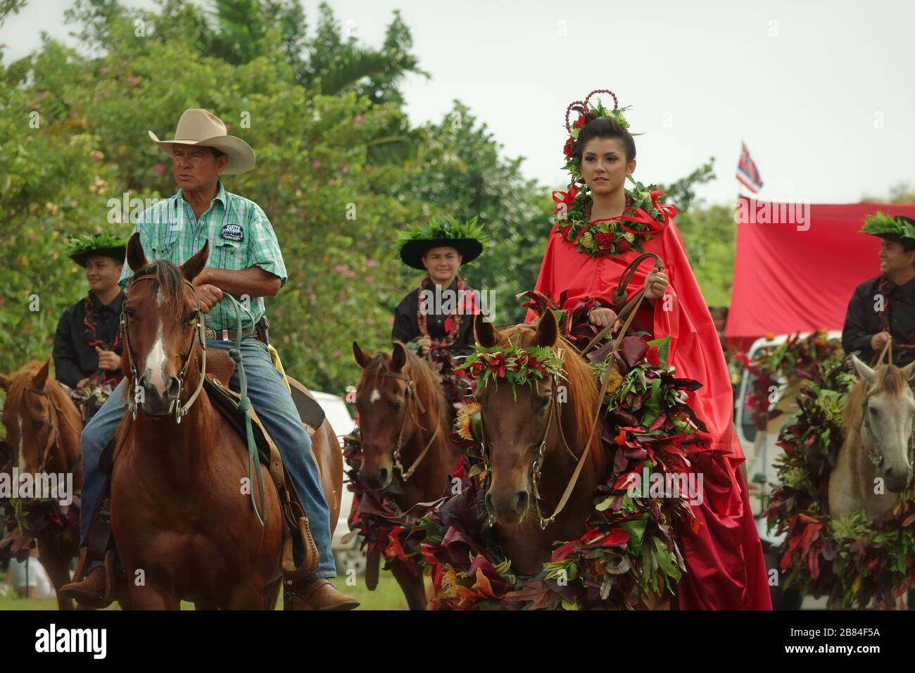 Lihue, Kauai, Hawaii / USA - June 9, 2018: A Pa‘u Princess, representing the island of Hawaii, rides on a horse at the annual King Kamehameha Parade. Stock Photo
