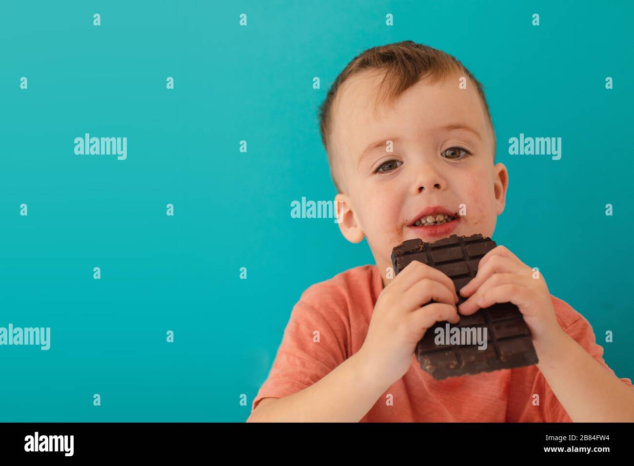 happy boy with chocolate bar Stock Photo