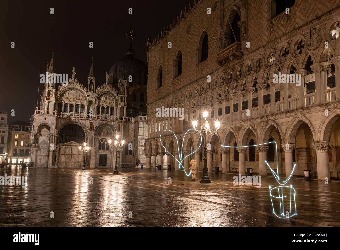 Writing with Light in front of the Illuminated Doge Palace on the Marks Square at Night, Venice/Italy Stock Photo