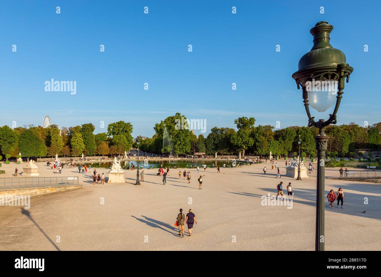 Women sit by the fountain in the Tuileries Garden on August 15 in News  Photo - Getty Images