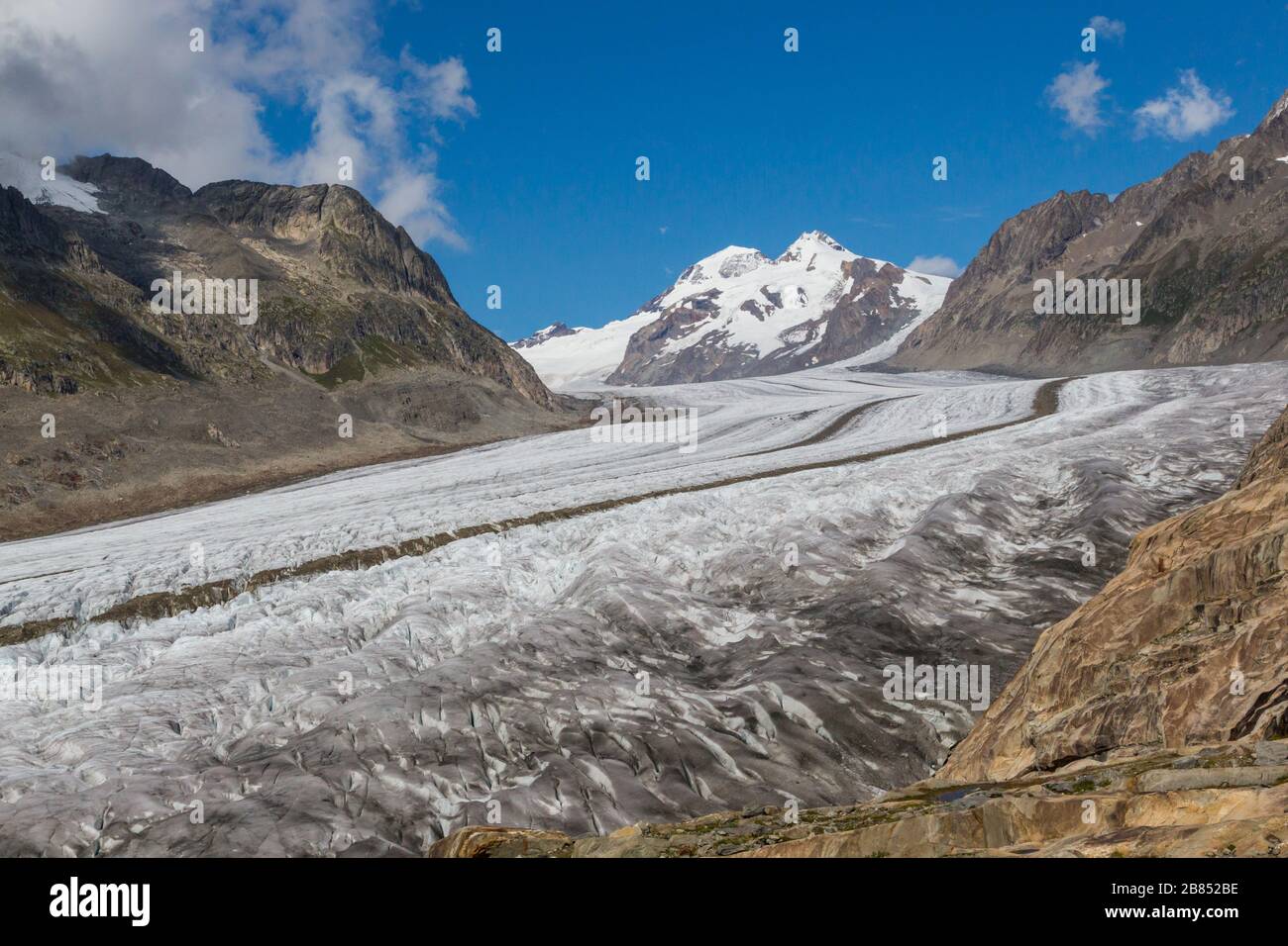 Aletsch glacier tongue in alpine mountain landscape in Switzerland, blue sky Stock Photo