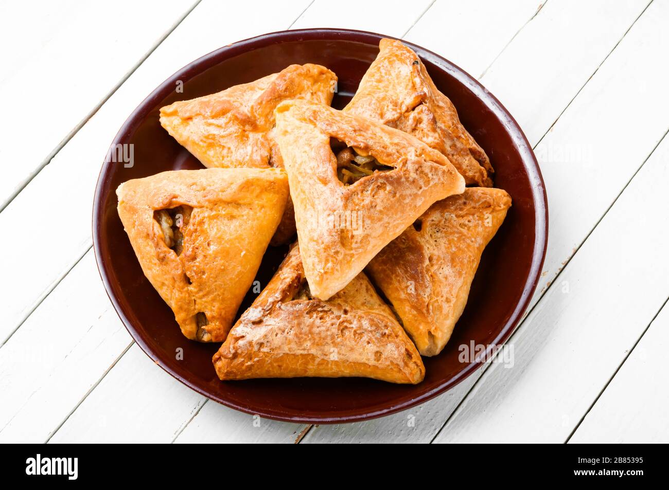 Homemade Russian pie Kurnik with chicken, potatoes and onions close-up on a  slate board on the table. horizontal Stock Photo - Alamy