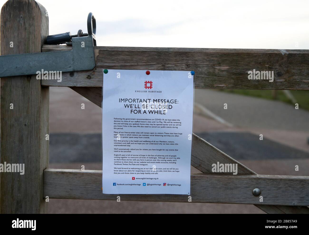 A sign on a footpath near Stonehenge on Salisbury Plain in Wiltshire, where the traditional equinox celebrations inside the stones were cancelled after English Heritage, which manages the attraction, closed the site until May 1 following government advice on coronavirus. Stock Photo