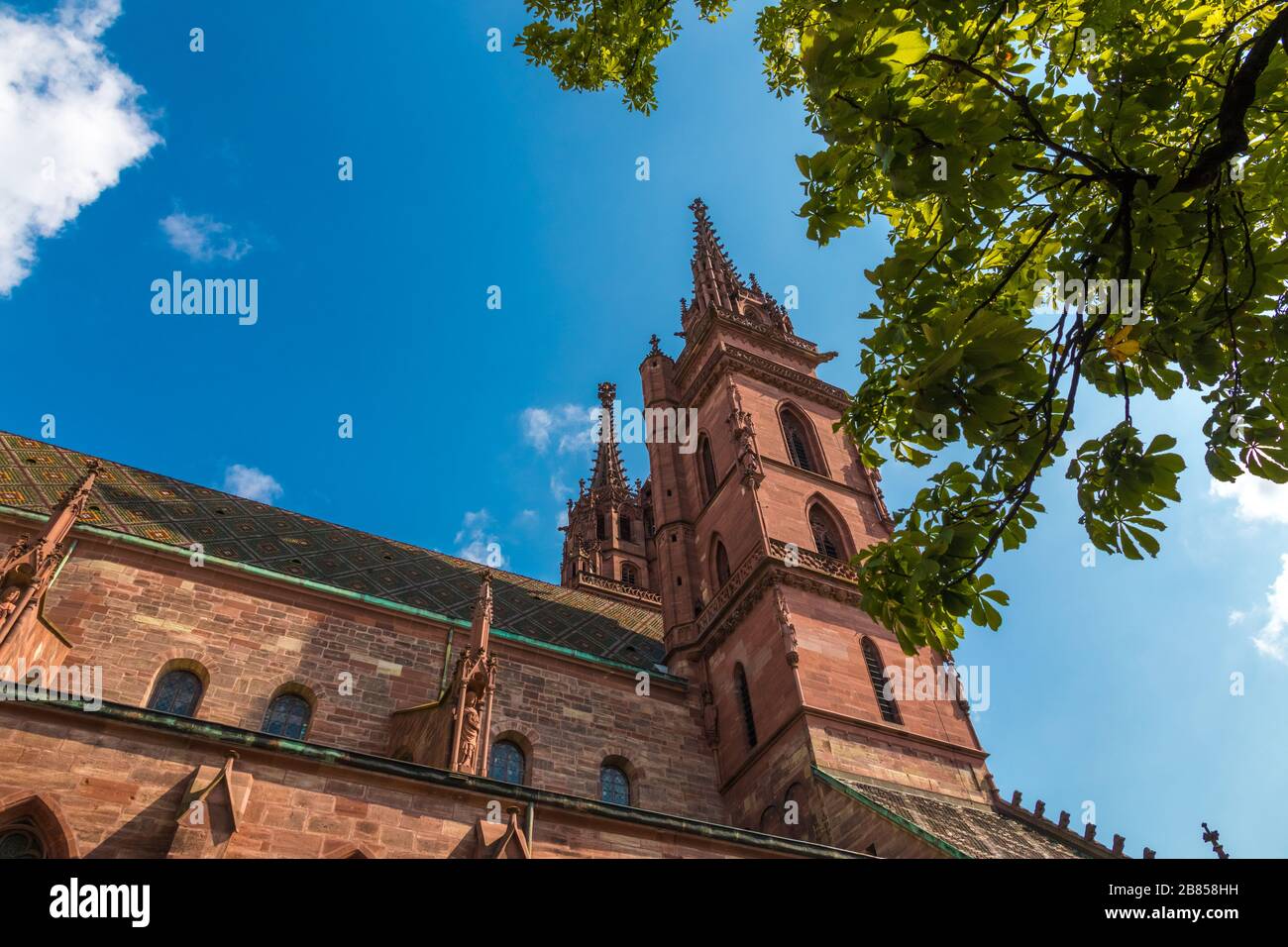 Great close-up view of the two towers and the main roof of the Basel Minster. The tower in front is called Georgsturm and the tower behind is called... Stock Photo