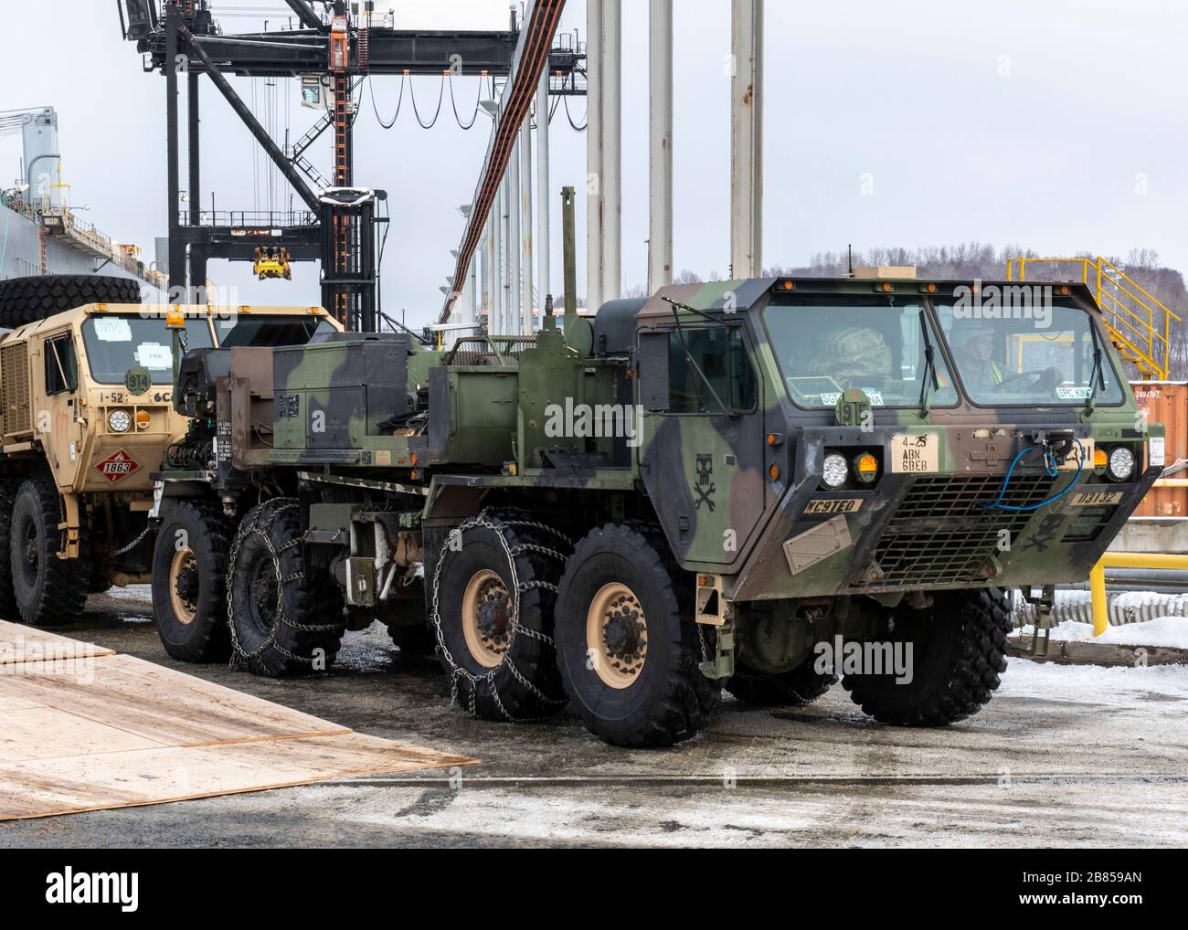 A U.S. Army Alaska Soldier offloads a Heavy Expanded Mobility Tactical