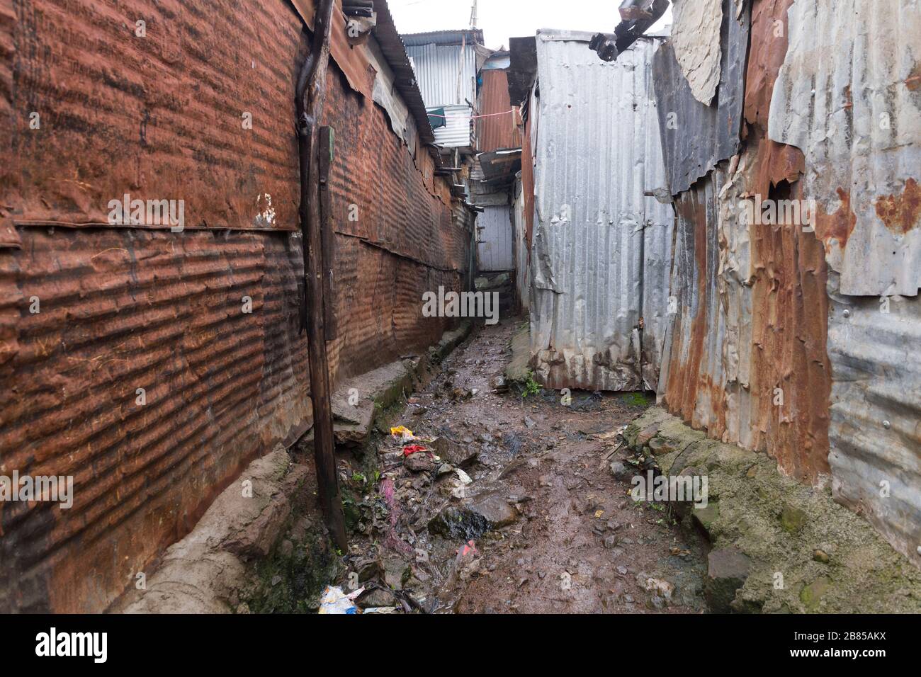 A rubbish strewn alleyway, Mathare, Nairobi, Kenya. Mathare is a ...