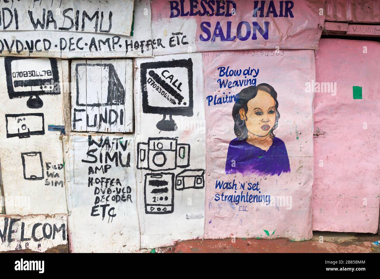 Hand painted advertisement on electrical shop and a hair salon, Mathare,  Nairobi, Kenya. Mathare is a collection of slums in North East of central N  Stock Photo - Alamy