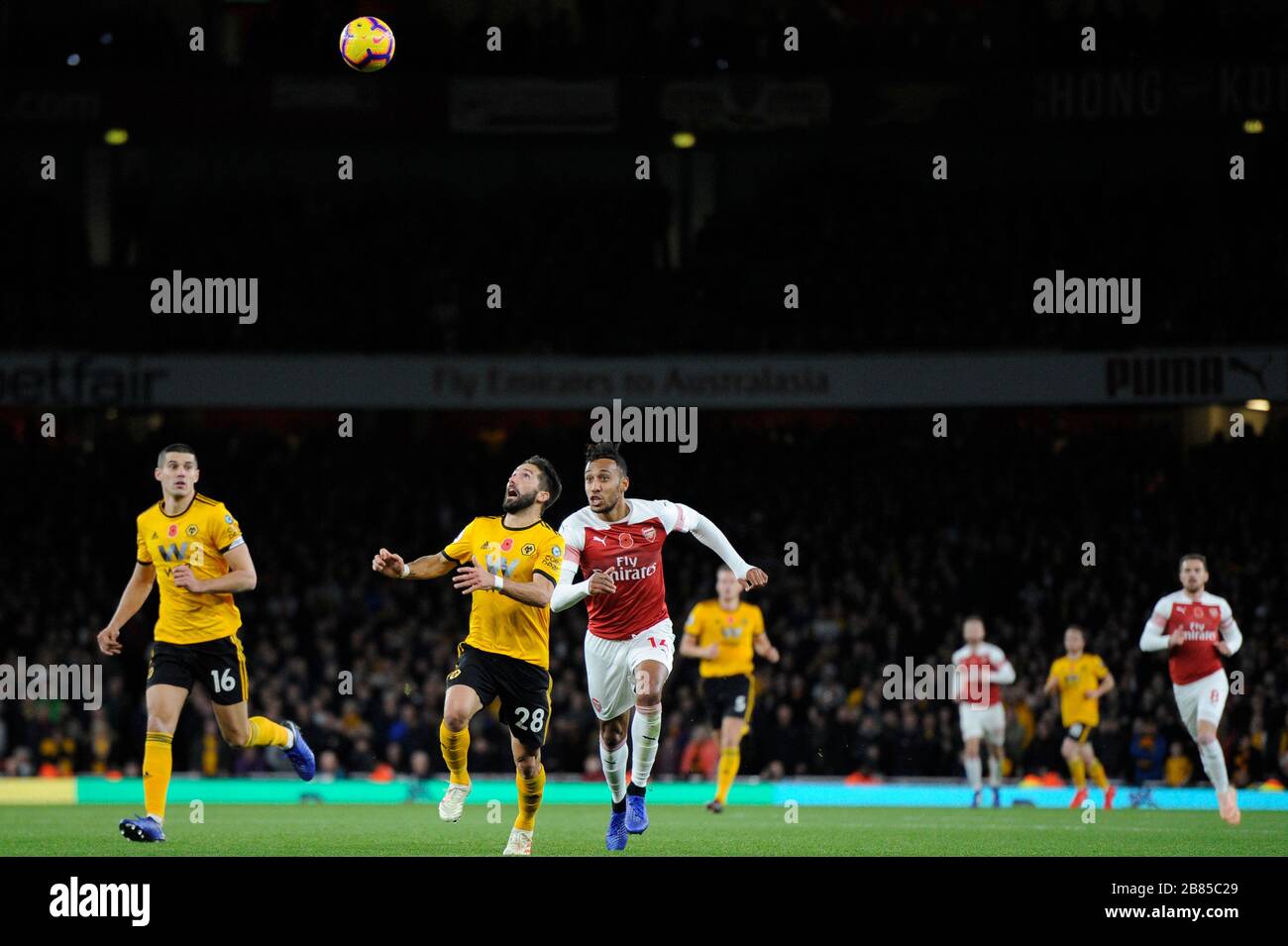 Pierre-Emerick Aubameyang of Arsenal and Joāo Moutinho of Wolverhampton Wanderers in action during the Premier League match between Arsenal and Wolverhampton Wanderers at Emirates Stadium in London, UK - 11th November 2018 Stock Photo