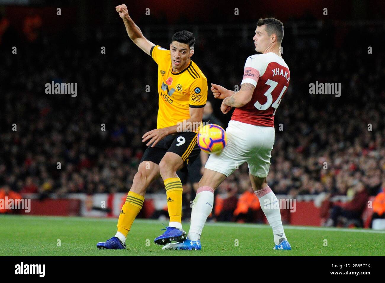 Granit Xhaka of Arsenal and Raœl Jiminez of Wolverhampton Wanderers in action during the Premier League match between Arsenal and Wolverhampton Wanderers at Emirates Stadium in London, UK - 11th November 2018 Stock Photo