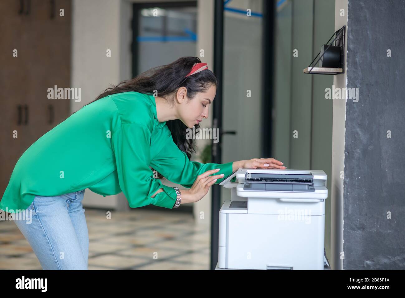 Woman in jeans bending over hi-res stock photography and images - Alamy