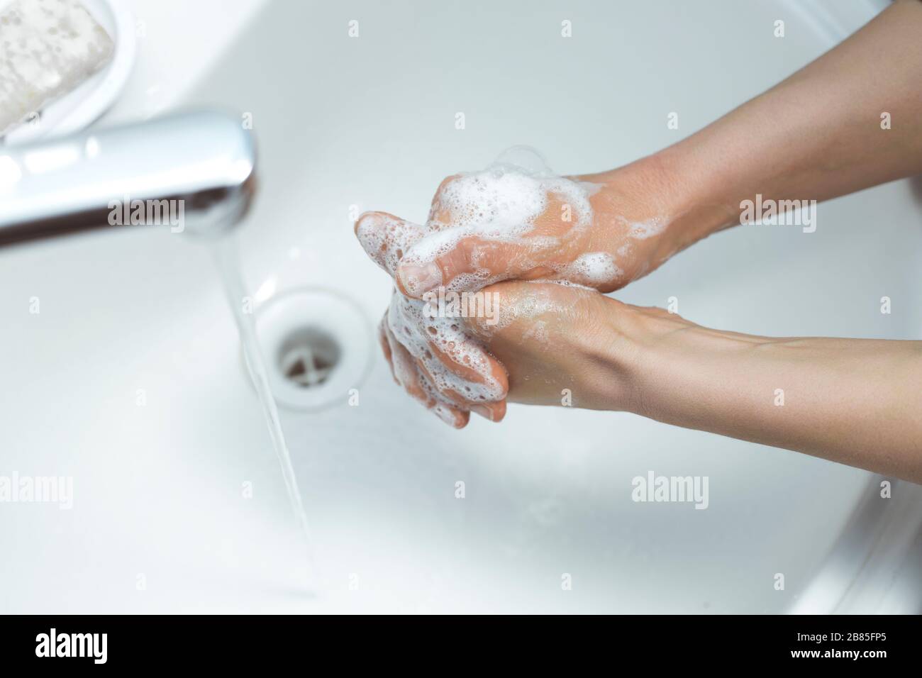 Hand washing with soap under water. Stock Photo