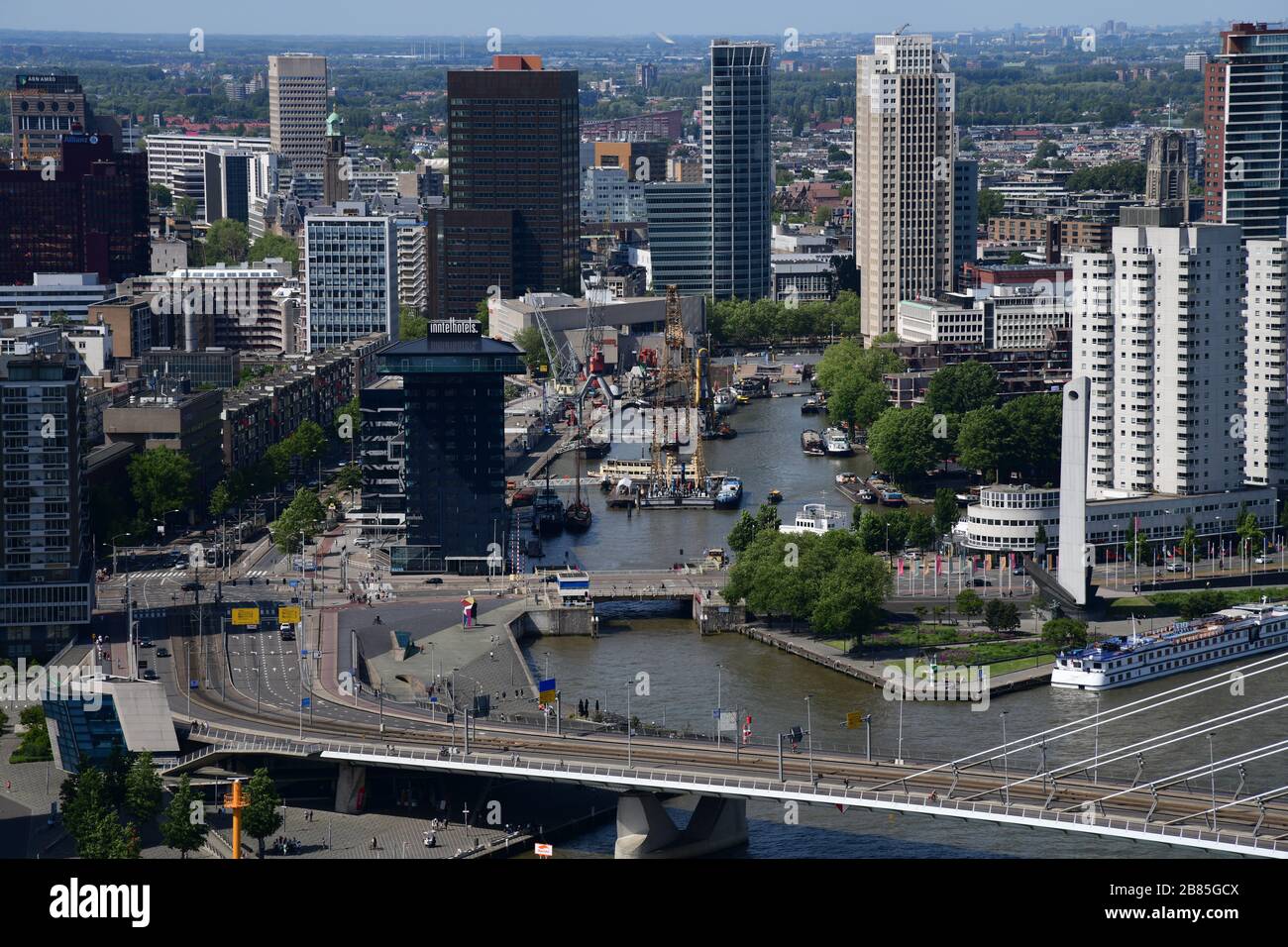 Birdseye view of the skyline of Rotterdam with the Ersamusbridge in the foreground taken from higrise The Rotterdam in the Netherlands Stock Photo