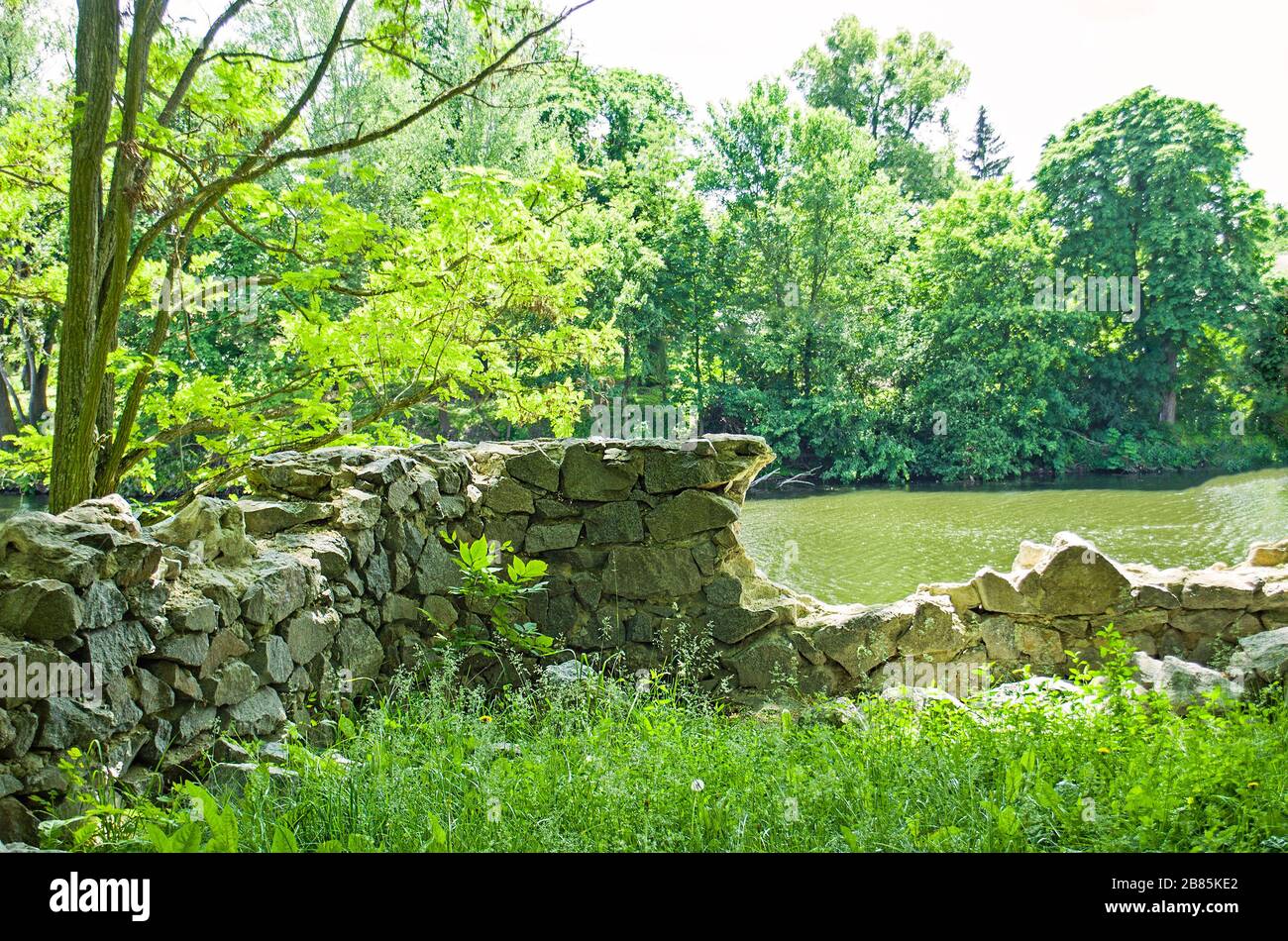 Old stone rock. Ancient ruins and river in a beautiful old park Stock ...