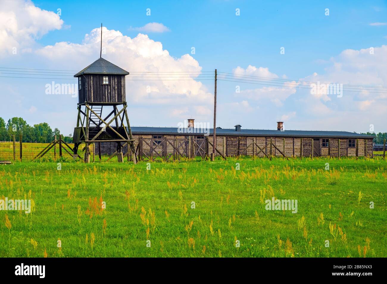 Lublin, Lubelskie / Poland - 2019/08/17: Panoramic view of the Majdanek KL Lublin Nazis concentration camp with guards towers and barbed-wire fences Stock Photo