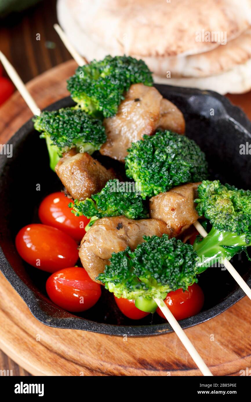 Vegan kebabs with seitan and broccoli on wooden skewers Stock Photo Alamy