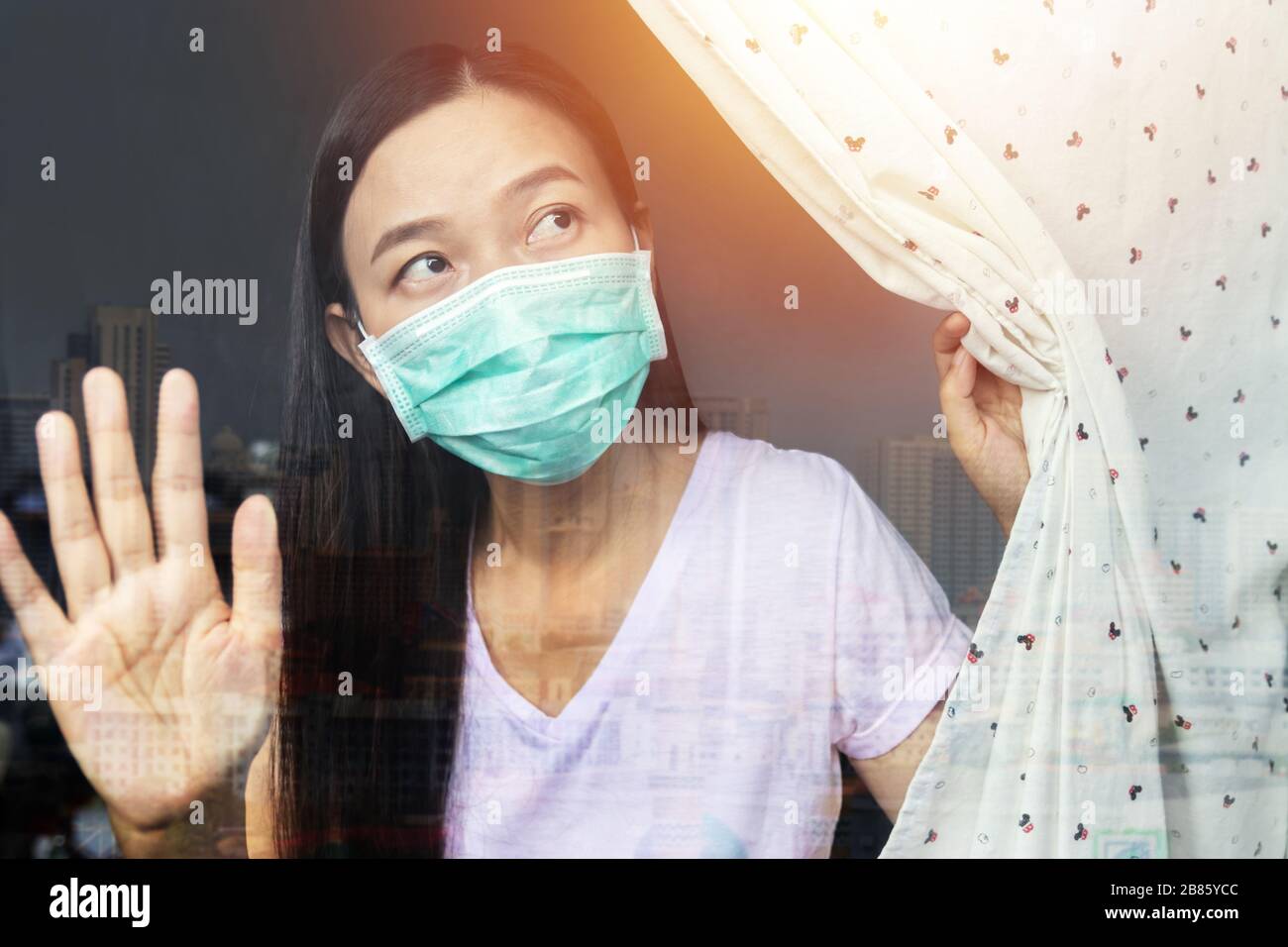 home quarantine concept. woman at risk of being infected with the Coronavirus stay isolation at home for self quarantine, prevention spreading of germ Stock Photo