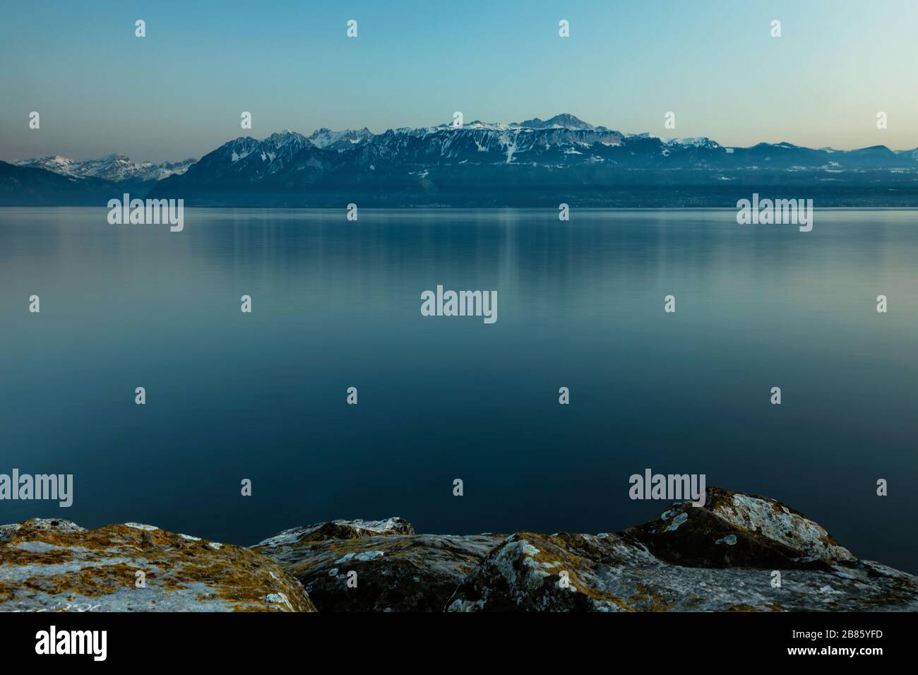 Beautiful sunset on the lake with alps in Lausanne Switzerland Stock Photo