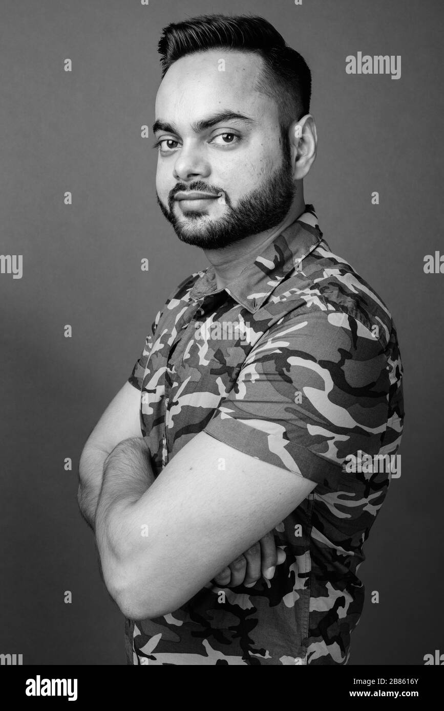 Indian man arms crossed Black and White Stock Photos & Images - Alamy