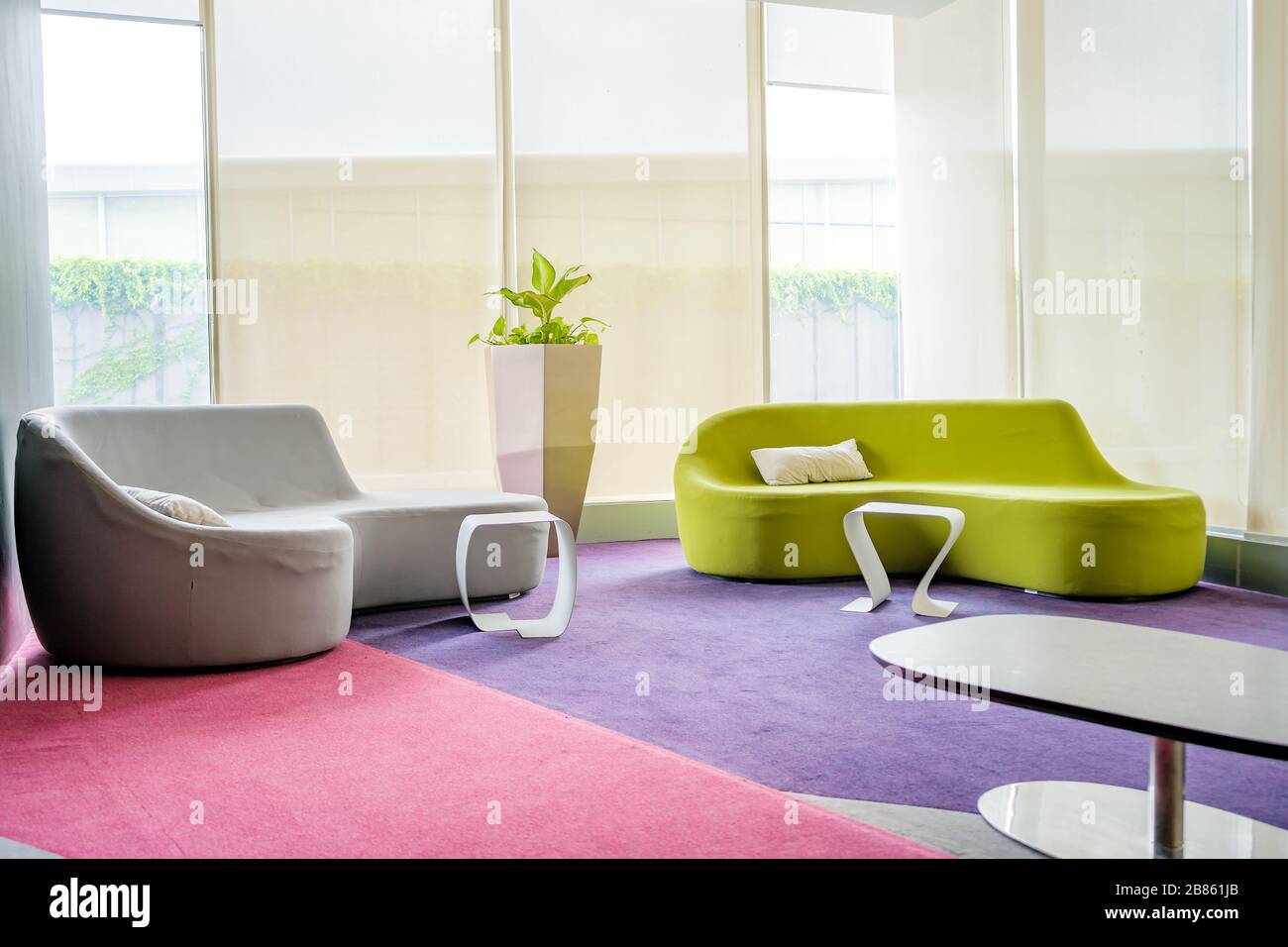 Reception room. interior of a waiting room, modern office, corridor with two sofa. Stock Photo