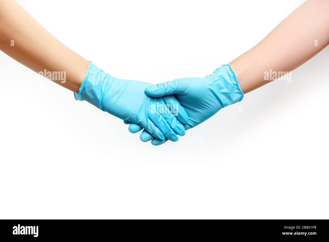 Handshake in blue medical gloves isolated on white background. Partial view. Stock Photo