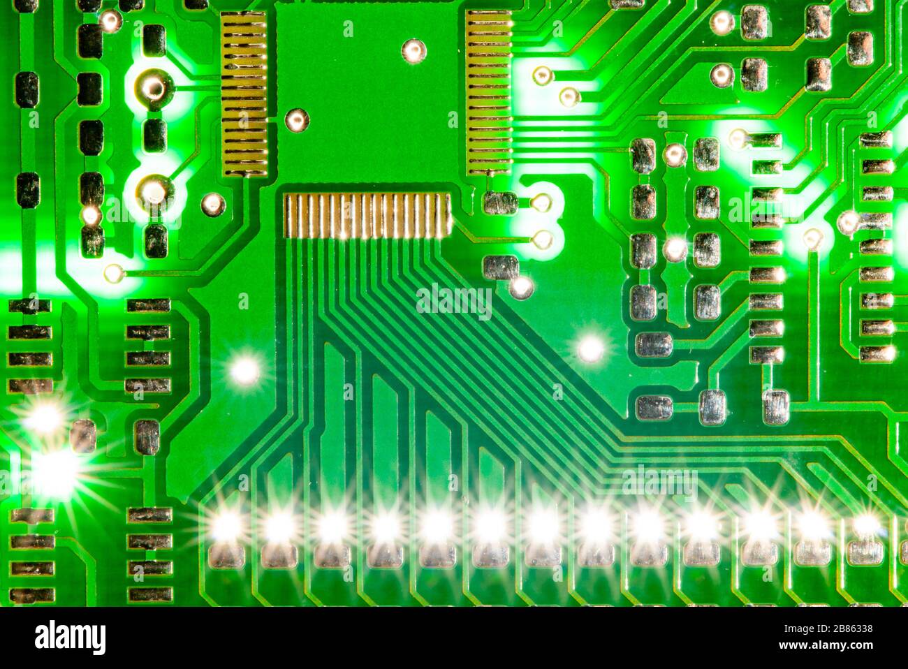 Close up photo of pcb printed circuit board electric with light flash