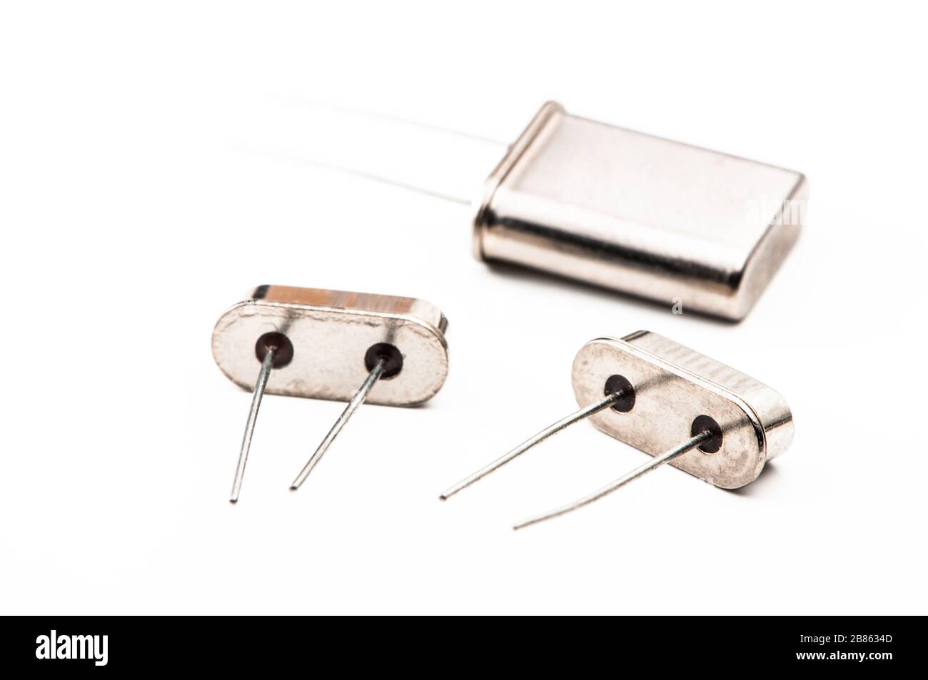 Various electronic components, quartz resonator closeup series on white background Stock Photo