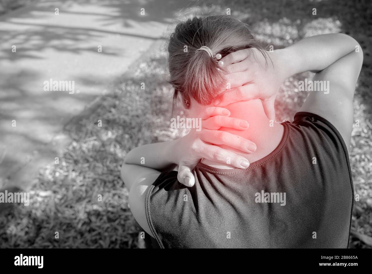 Neck pain during training. woman runner with sport injury in sports bra