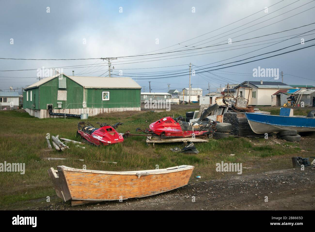 Inuit village with jet-skies, and boats at the forefront, Barrow, Alaska Stock Photo