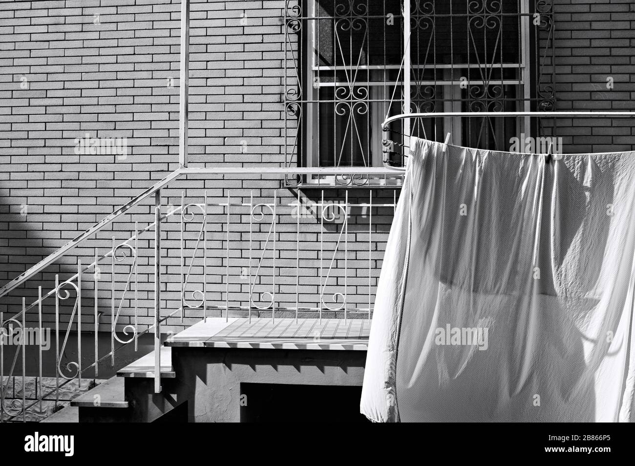 White sheets hanging on the drying rack outside the balcony (Pesaro ...