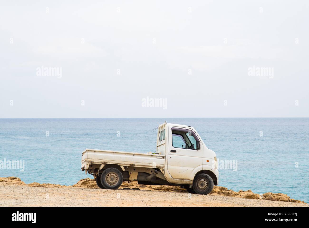 Protaras. Cyprus - October 9, 2018: White Truck in Protaras on Cyprus. Sea on Background. Stock Photo